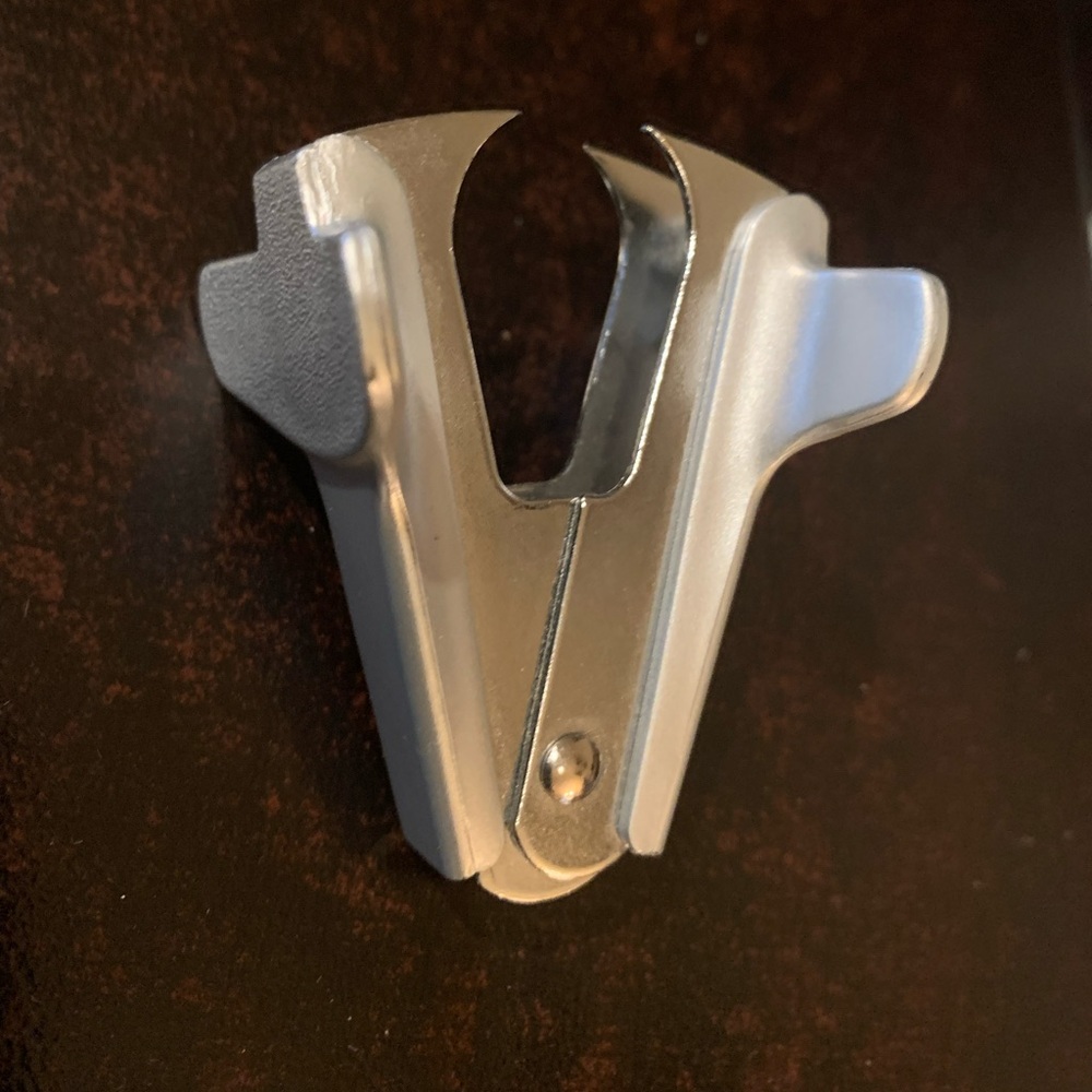 Sleek silver metal staple remover.